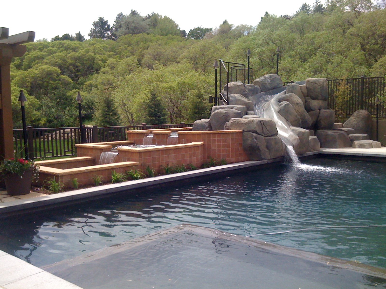 Swimming Pool with slide and waterfalls