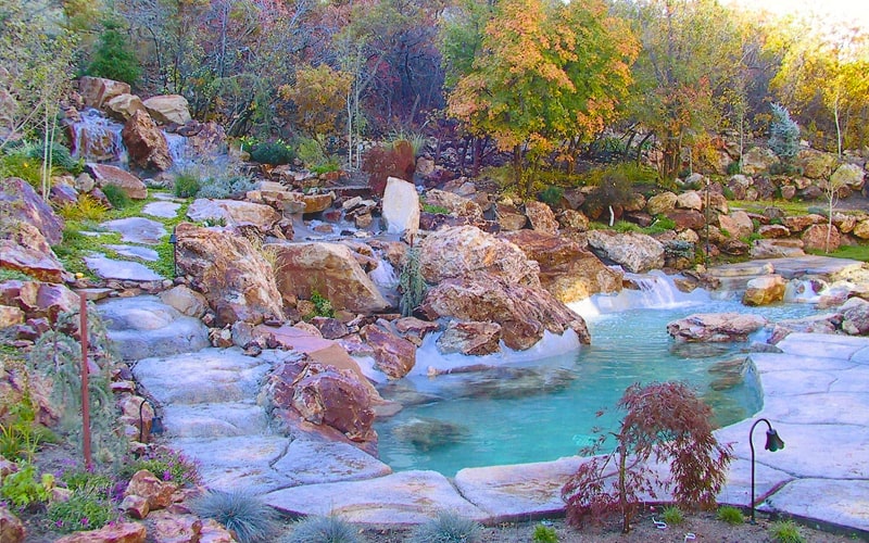 Backyard water feature repair hardscaping landscape | Utah Custom Pool Builders | SBI Waterfalls | Stevenson Brothers Custom Pools