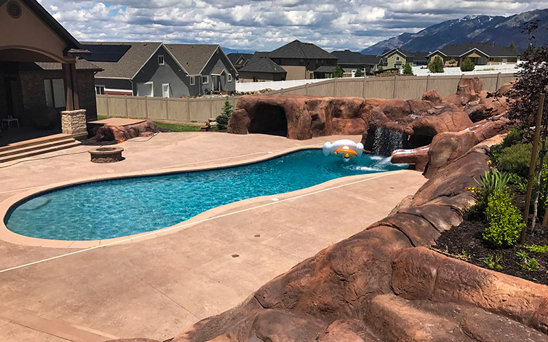 Utah Swimming Pool Builders & Custom Pool Slide Contractors | Stevenson Brothers Custom Pools | SBI Waterfalls