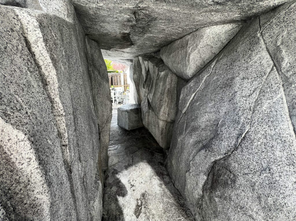 Private grotto features artifical rock with natural design aesthetic in Salt Lake City, Utah landscaping construction project