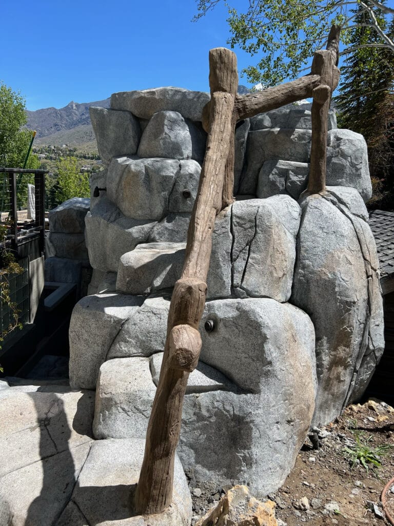 Artificial Concrete Rock Work with natural rock and wood aesthetic in Salt Lake City, Utah backyard patio
