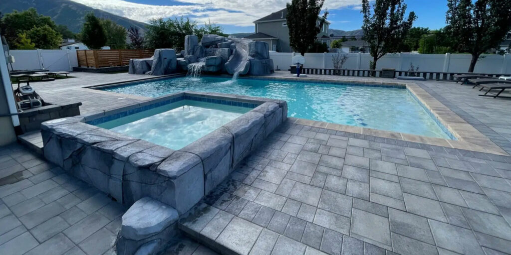 Custom salt water swimming pool and hot tub built by Stevenson Brothers Custom Pools in Salt Lake City, Utah